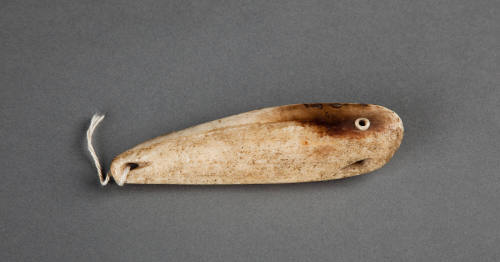 Ivory Fetish, c. 1900
Inupiaq culture; Alaska
Walrus ivory, baleen and operculum; 4 1/8 x 1 x…