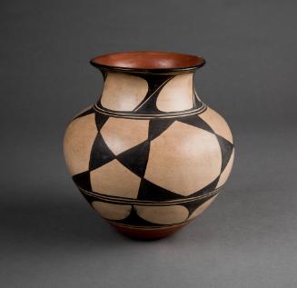 Vessel, c. 1930
Santo Domingo Pueblo; New Mexico
Clay and pigment; 9 5/8 x 8 1/2 in.
20484
…