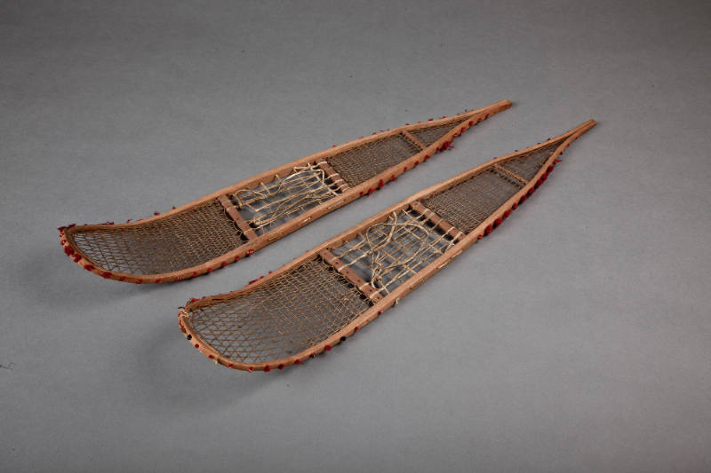 Model Snowshoes, early 20th Century
Athabaskan culture; Alaska
Wood, fiber and leather; 2 3/4…