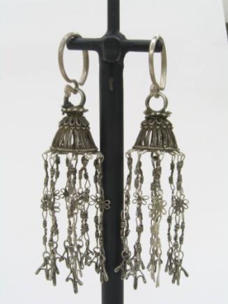 Earrings, 20th Century
Miao culture; Guizhou Province, China
Silver; 1 x 3 1/2 in.
2007.23.2…