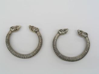 Bracelets with Dragon Head Motifs, 20th Century
Miao culture; Guizhou Province, China
Silver;…