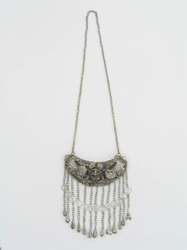 Ornament, 20th Century
Dong culture; China
Silver; 13 1/2 x 23 in.
2007.23.28
Gift of Anne …