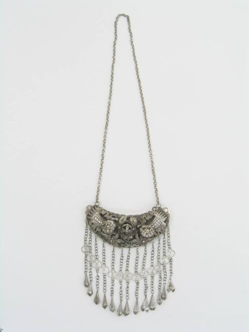 Ornament, 20th Century
Dong culture; China
Silver; 13 1/2 x 23 in.
2007.23.28
Gift of Anne …