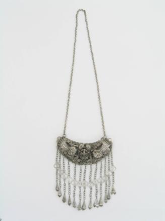Ornament, 20th Century
Dong culture; China
Silver; 13 1/2 x 23 in.
2007.23.28
Gift of Anne …