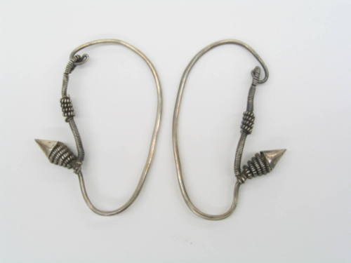 Earrings, 20th Century
Miao culture; probably Guizhou Province, China
Silver; 2 × 2 3/4 in.
…