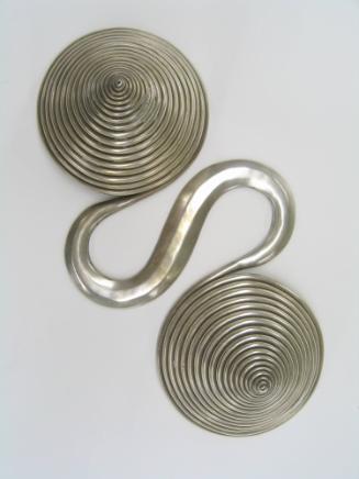 Counterweight, 20th Century
Miao culture; Guizhou Province, China
Silver; 12 x 3 1/2 x 6 in.
…