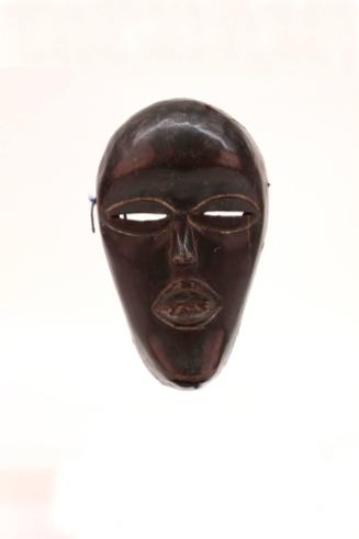 Mask (Deangle), early 20th Century
Dan culture; Liberia, Africa
Wood, metal and pigment; 9 3/…