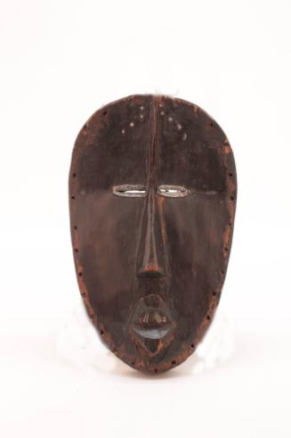 Mask (Deangle), early 20th Century	
Dan culture; Liberia, Africa
Wood, metal and pigment; 10 …