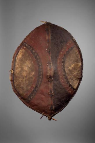 Warrior's Shield, 20th Century
Maasai culture; Tanzania
Leather, wood and pigment; 35 x 26 in…