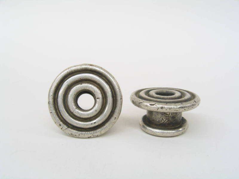 Circular Ear Spools, 20th Century
Miao culture; Taijiang County, Guizhou Province, China
Silv…