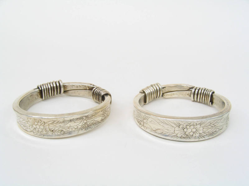 Bracelets with Incised Floral Designs, 20th Century
Miao culture; Guizhou Province, China
Sil…