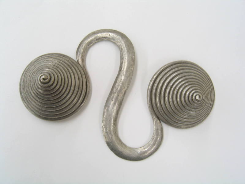 S-Shaped Counterweight, 20th Century
Miao culture; Guizhou Province, China
Silver; 6 1/4 × 4 …