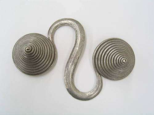 S-Shaped Counterweight, 20th Century
Miao culture; Guizhou Province, China
Silver; 6 1/4 × 4 …