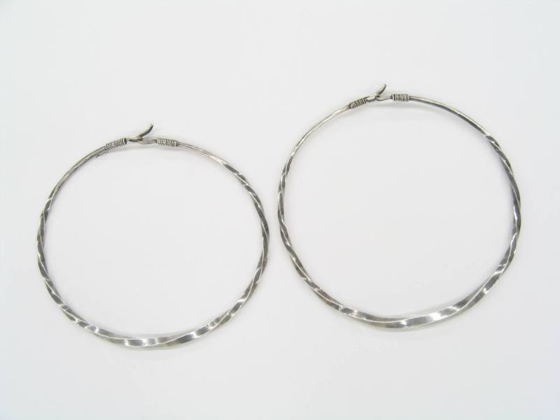 Pair of Twisted Neck Rings, 20th Century
Miao culture; Guizhou Province, China
Silver; 8 1/2 …