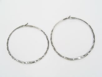 Pair of Twisted Neck Rings, 20th Century
Miao culture; Guizhou Province, China
Silver; 8 1/2 …