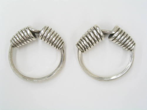 Pair of Bracelets with Coil Accents, 20th Century
Miao culture; Guizhou Province, China
Silve…