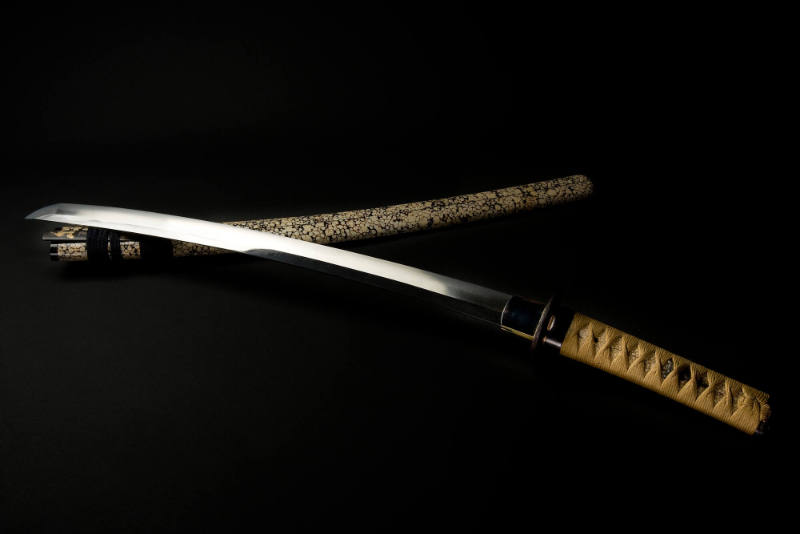 Wakizashi Sword, 15th century
Japanese
Steel, manta ray skin, lacquer, silk and iron; 2 3/4 x…