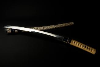 Wakizashi Sword, 15th century
Japanese
Steel, manta ray skin, lacquer, silk and iron; 2 3/4 x…