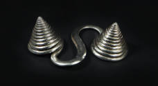 S-Shaped Counterweight, 20th Century
Dong or Miao culture; Guizhou Province, China
Silver; 2 …