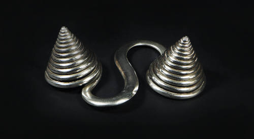 S-Shaped Counterweight, 20th Century
Dong or Miao culture; Guizhou Province, China
Silver; 2 …
