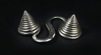 S-Shaped Counterweight, 20th Century
Dong or Miao culture; Guizhou Province, China
Silver; 2 …