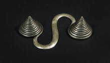 S-Shaped Counterweight, 20th Century
Dong or Miao culture; Guizhou Province, China
Silver; 5 …