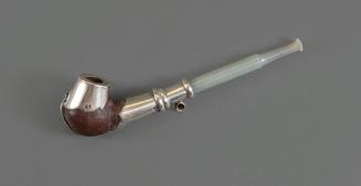 Tobacco Pipe, 20th Century
Miao culture; Guizhou Province, China
Wood, silver and jade; 2 × 7…