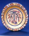 Bowl, 600-900 CE
Maya culture; possibly Yucatán, Mexico
Ceramic and pigment; 2 5/8 × 13 1/2 i…