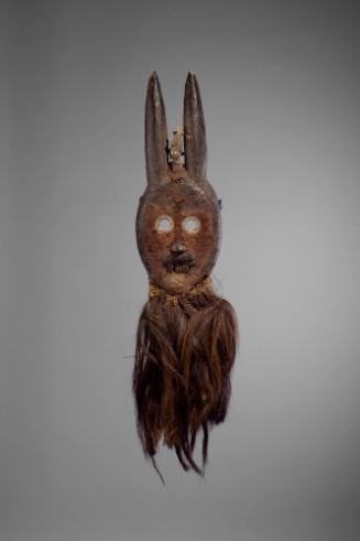 Mask, 20th Century
Toma or Loma culture; Liberia
Wood, fiber, leather and metal; 15 × 3 7/8 ×…