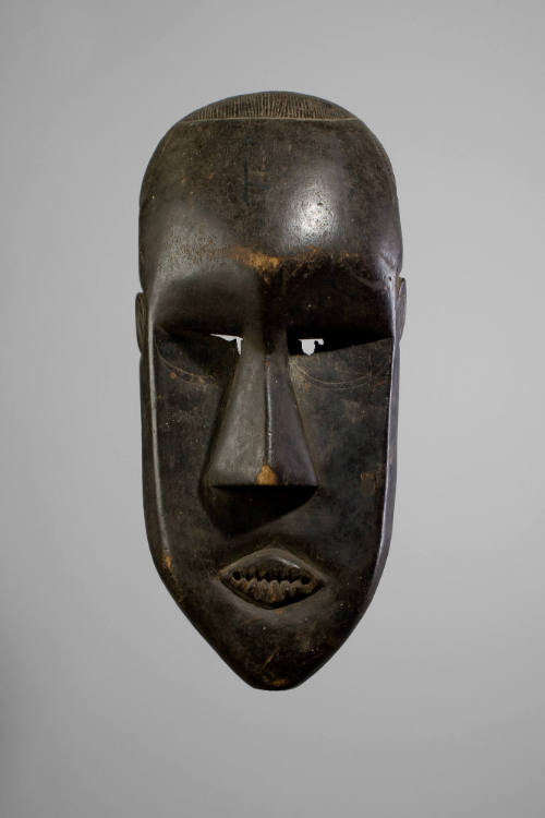 Poro Society Mask, 20th Century
Mende people; Ivory Coast
Wood; 24 5/8 x 10 3/4 x 11 3/4 in.
…