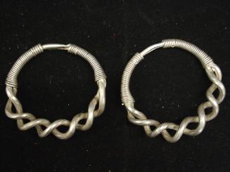 Bracelets, 20th Century
Miao culture; probably Guizhou Province, China
Silver; 3 1/2 in.
99.…