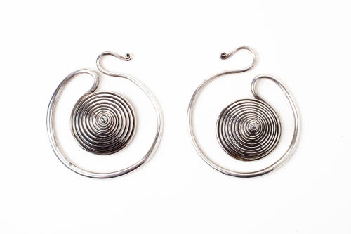 Coiled Earrings, 20th Century
Miao culture; Guizhou Province, China
Silver; 2 3/4 x 1 1/4 x 3…