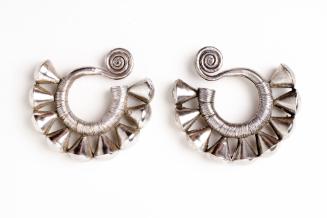 Earrings, 20th Century
Dong culture; Guizhou Province, China
Silver; 3 3/4 x 3 1/2 in.
2001.…