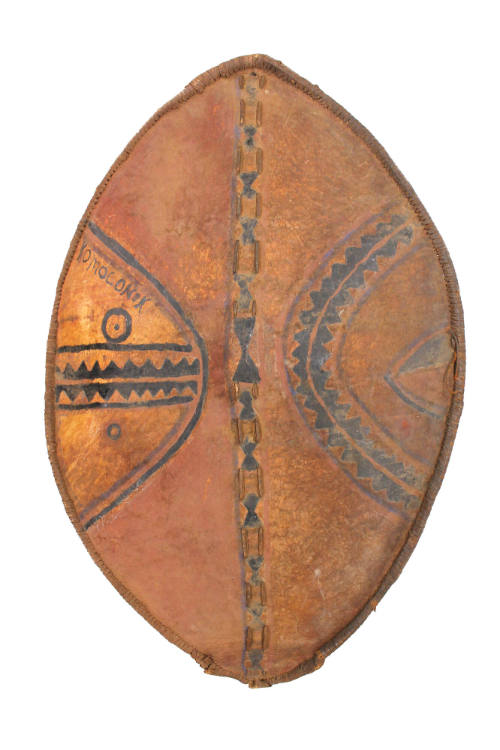 Shield, 20th Century
Maasai culture; Tanzania
Leather, wood, pigment and lion fur; 43 × 29 1/…