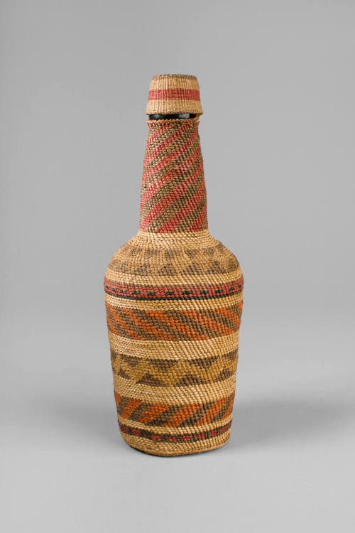 Basketry Bottle, date unknown
Makah people; Washington
Cedar and squaw grass; 8 1/2 x 3 in. 
…