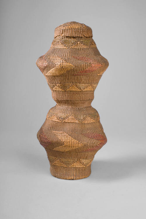 Rattle, c. 1880
Tlingit culture; Sitka, Alaska
Spruce root and dyed grass; 10 3/4 × 4 in.
44…