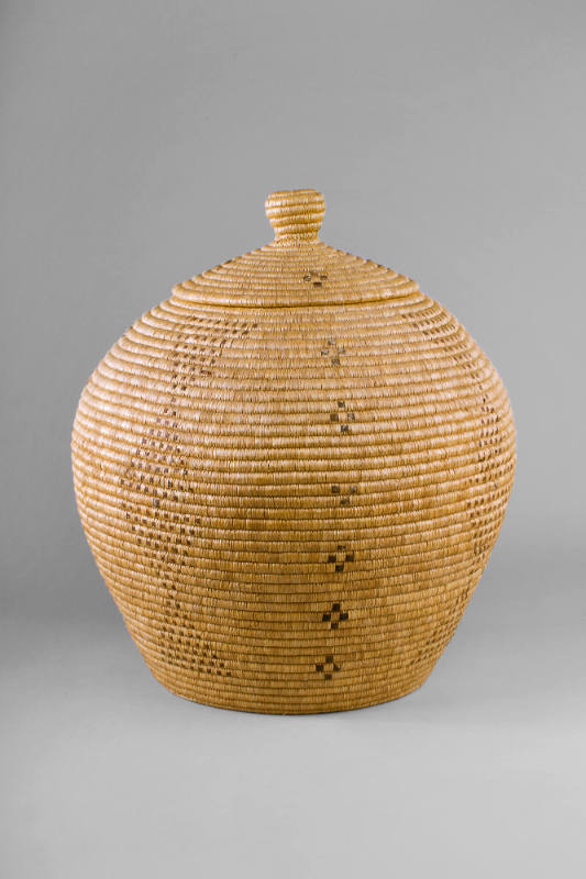 Basket, 20th Century
Inuit people; Alaska
Natural grasses and seal skin or large reptile skin…