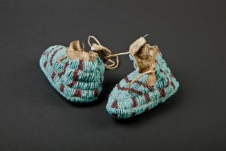 Infant Moccasins, 1880-1910
Lakota culture; Northwestern Plains
Tanned deer leather and glass…