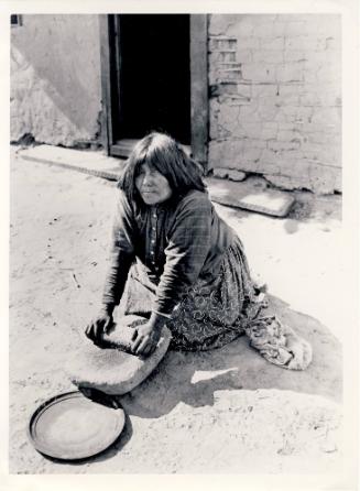 Yuma Woman Grinding Corn, Showing Use of Metate, unknown date
Unknown photographer
Paper; 6 x…