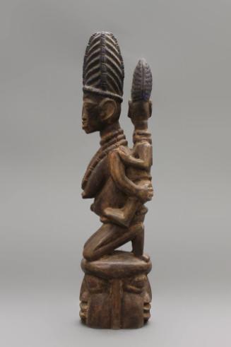 Mask Figure (Epa), 20th Century
Yoruba culture; Nigeria, Africa 
Wood; 14 × 3 1/16 × 3 3/8 in…