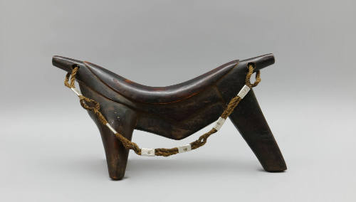 Headrest, early 20th Century
Dinka culture; South Sudan
Wood, fiber and metal; 10 1/2 × 20 1/…