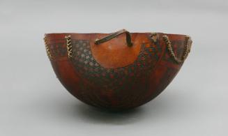 Bowl, 20th Century
possibly Oromo culture; Ethiopia
Gourd, fiber, leather and pigment; 4 3/4 …