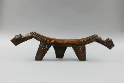 Headrest, early 20th Century
Dinka culture; South Sudan
Wood, metal and fiber; 6 3/4 × 25 1/2…