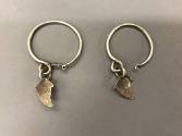 Earrings, 20th Century
Miao culture; probably Guizhou Province, China
Silver; 2 x 3 1/2 in.
…