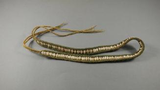 Shell Necklace, mid 20th Century
Palau, Micronesia
Cowrie shell and fibers; 5/8 × 32 1/2 in.
…