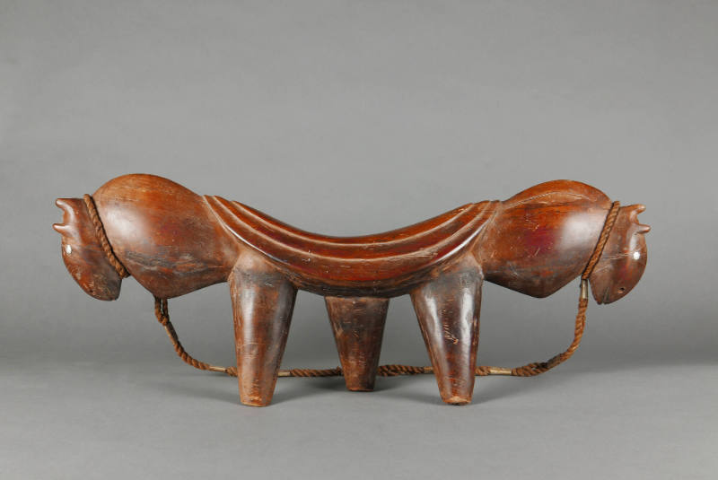 Headrest, 20th Century
Dinka culture; South Sudan
Wood, fiber and metal; 10 1/2 × 28 × 4 in.
…