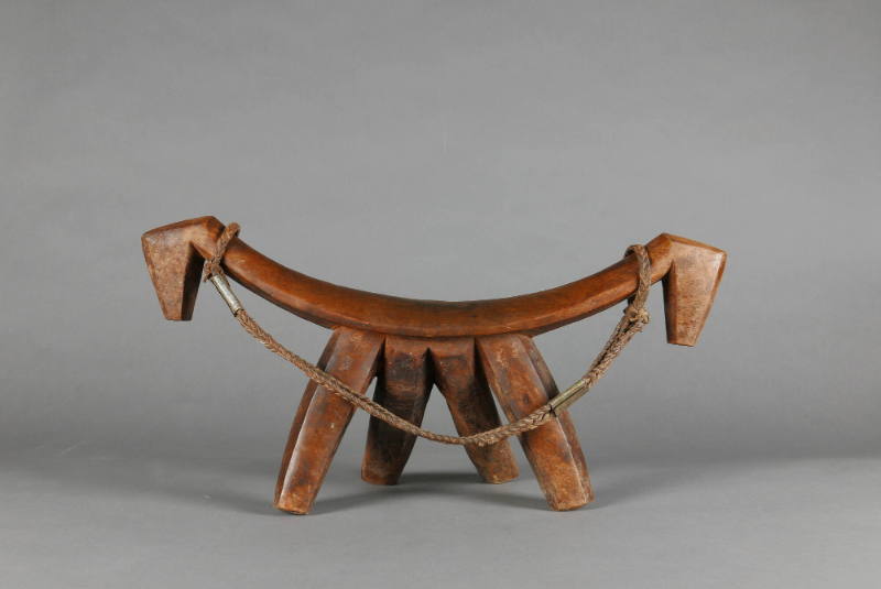 Headrest, 20th Century
Dinka culture; South Sudan
Wood, leather and metal; 10 × 22 × 6 in.
2…