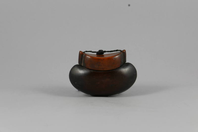 Tobacco Container, 20th Century
Miao culture; China
Wood and fiber; 2 3/4 × 4 × 1 1/2 in.
20…