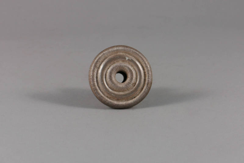 Ear Spool, 20th Century
Miao culture; probably Guizhou Province, China
Silver; 1 × 1 5/8 in.
…