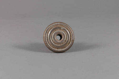 Ear Spool, 20th Century
Miao culture; probably Guizhou Province, China
Silver; 1 × 1 5/8 in.
…